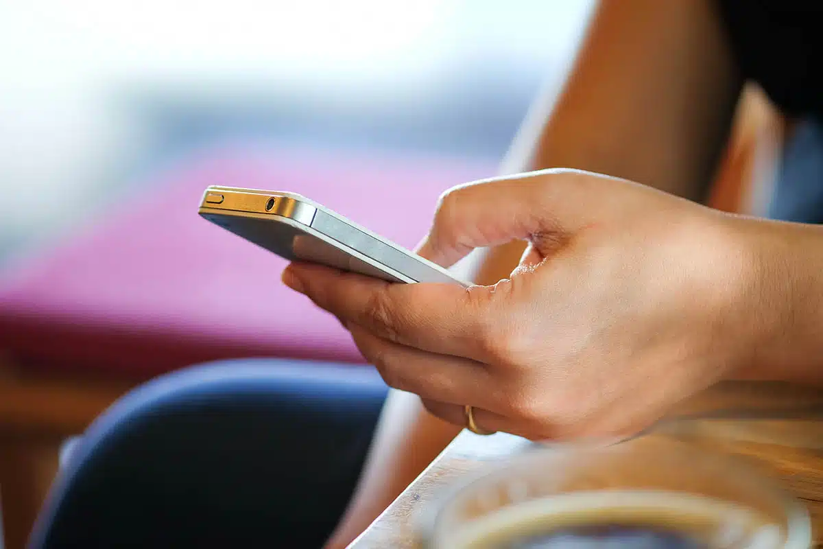 Women are playing smart mobile phones.