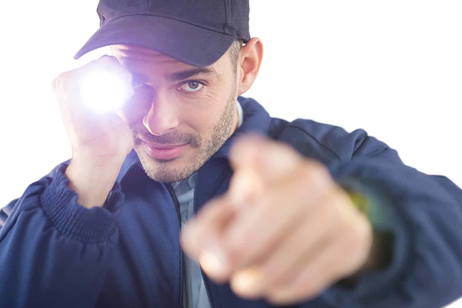 Security officer holding a torch