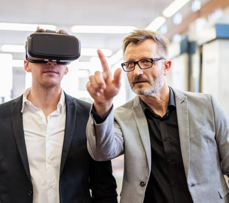 two-businessmen-with-vr-glasses-in-factory