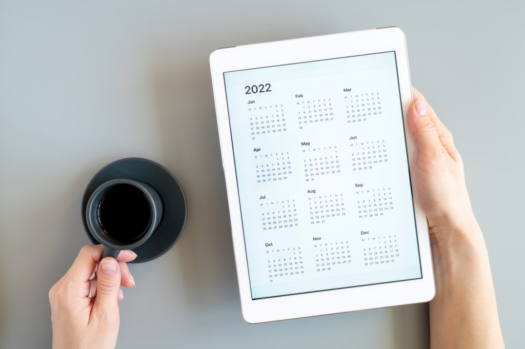 woman-s-hands-holding-tablet-computer-with-open-ca-2021