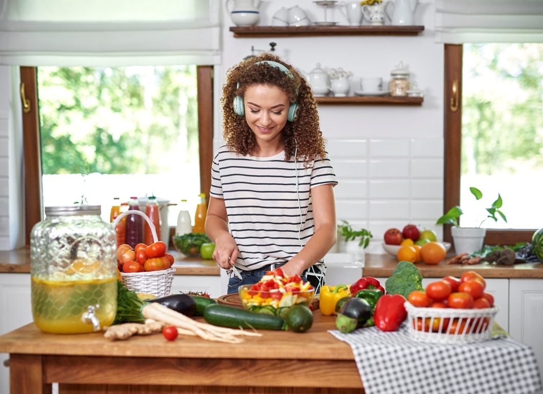 woman-cooking-and-listening-to-music-2021