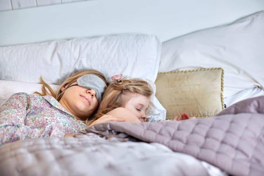 mother-and-daughter-sleeping-in-bed-2022