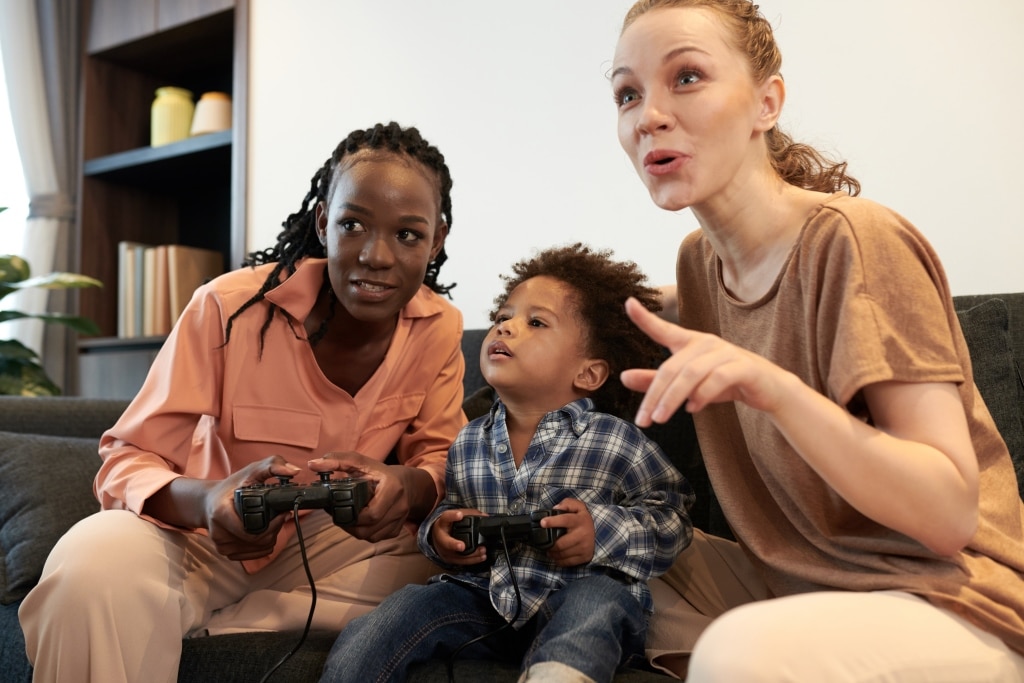 diverse-parents-and-son-playing-video-game